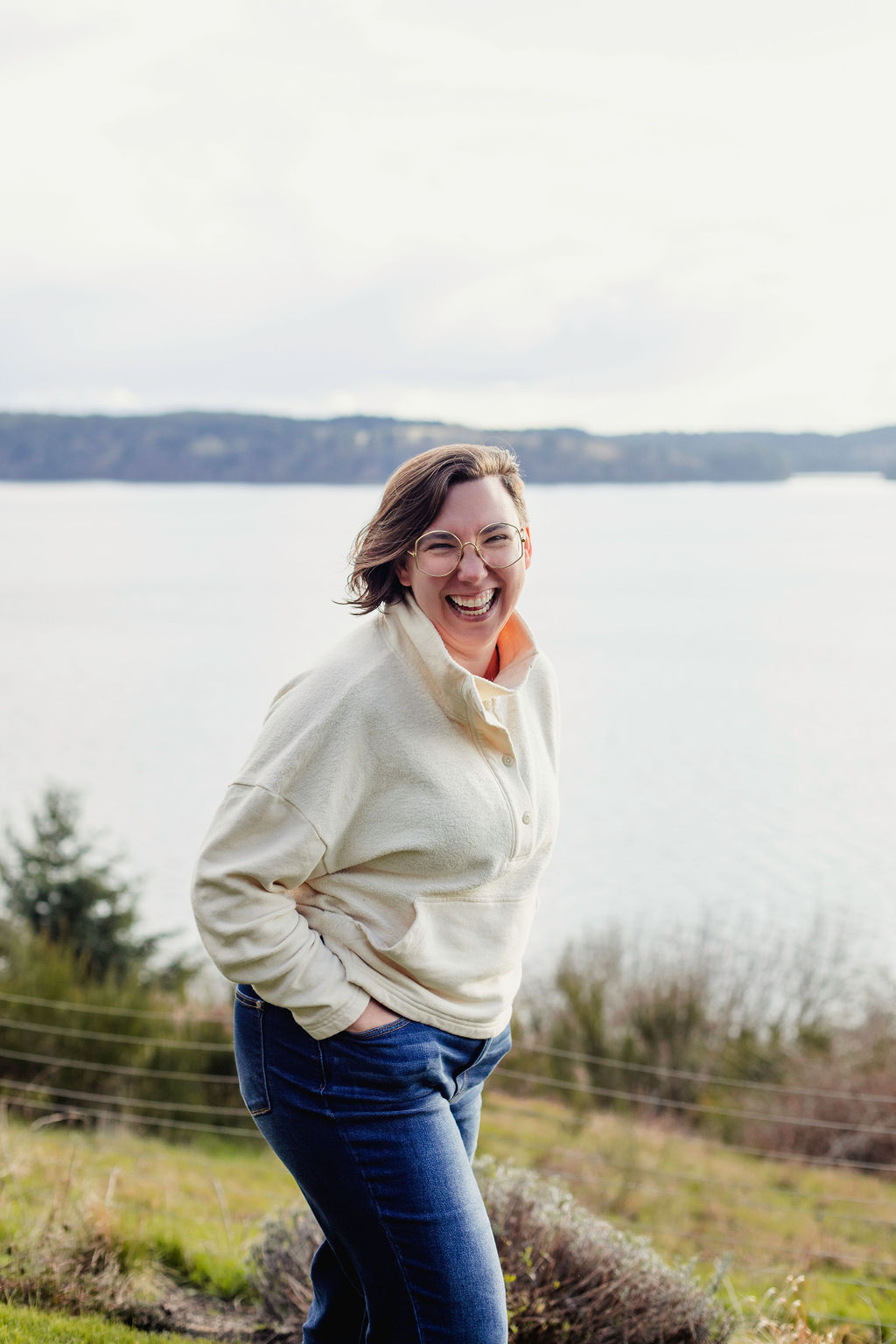 Kate Rae Davis Kate Rae Davis laughing on the bank of a lake